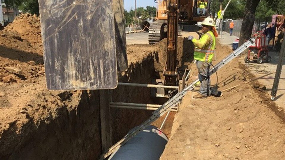 large trench being dug with a digger