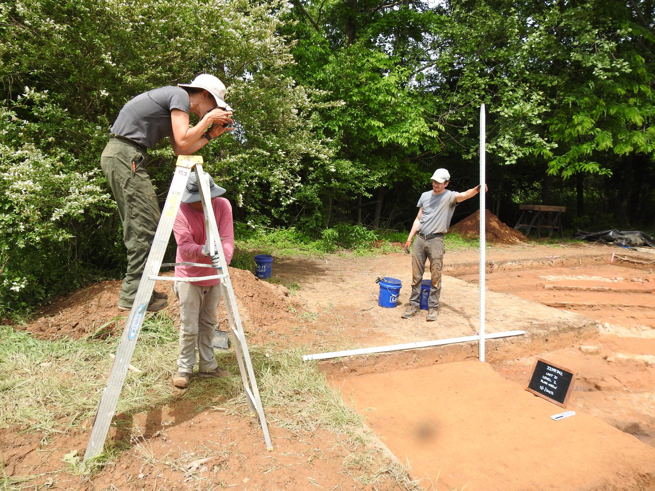 Stinchcomb takes a picture to document the site. 