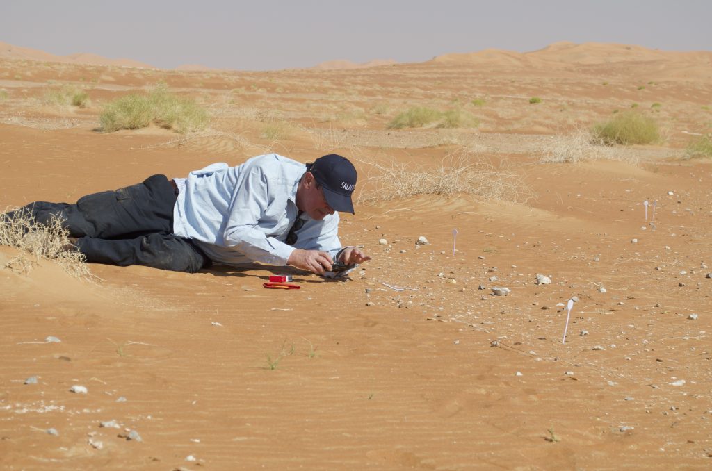 Vincent Charpentier in the field at Rub al-Khali conducting surface identification of artifacts and systematic photographic documentation of numbered objects prior to their collection (Copyright: Adam Al-Ghafri)