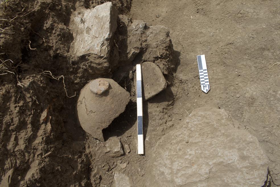 This feature was excavated in 2024 and represents a seed processing area with milling equipment and ceramic vessel carefully stored upside down for future use. Relative dating places the artifacts into the early Bronze Age, likely close to 4,000 years old.