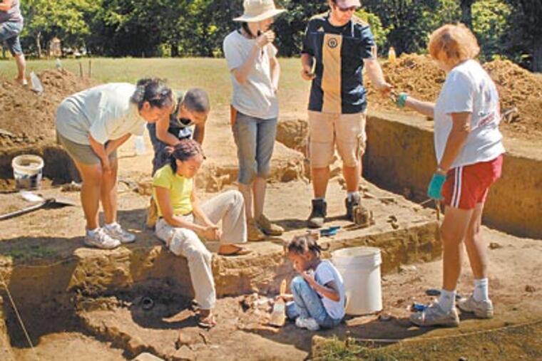 Barton (second from right), hosts a "sandbox" archaeology day at the site of the William Davis home in Timbuctoo.