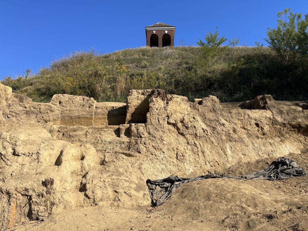 A view of the steep collapsed western edge of Section T of the national cemetery after approximately 60 at-risk burials had been removed by mid-October 2023.